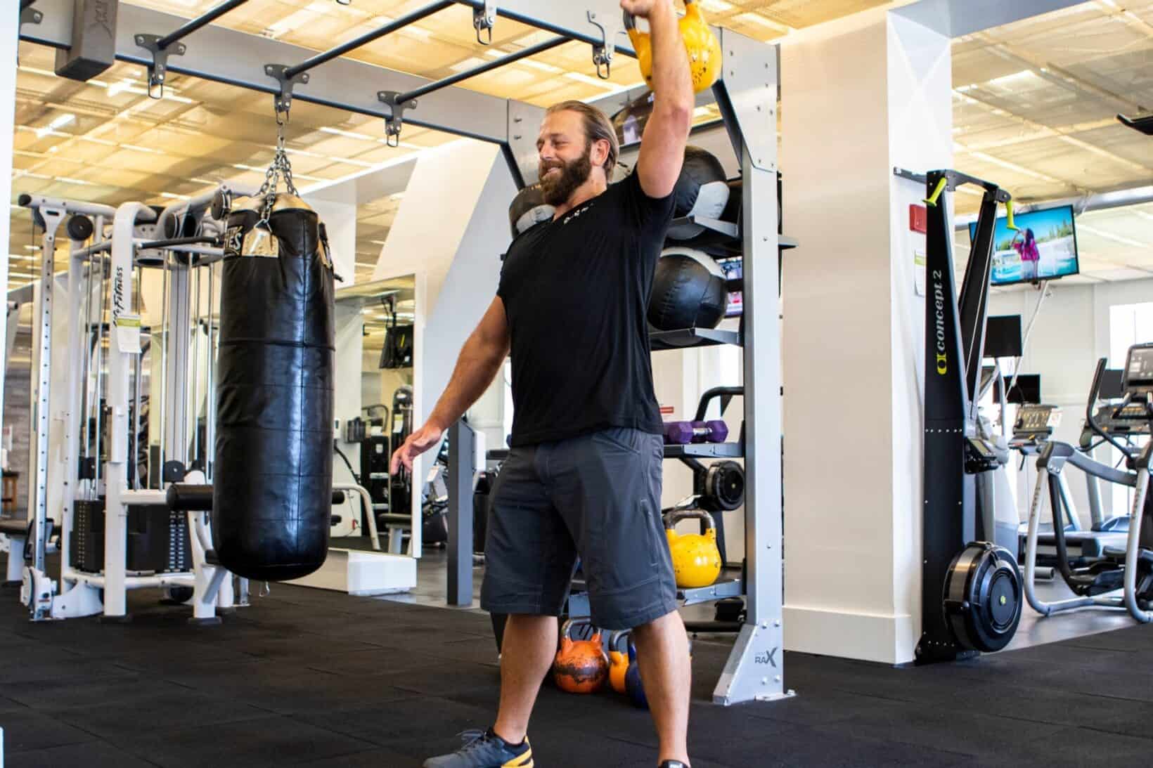 Man holding kettlebell in gym