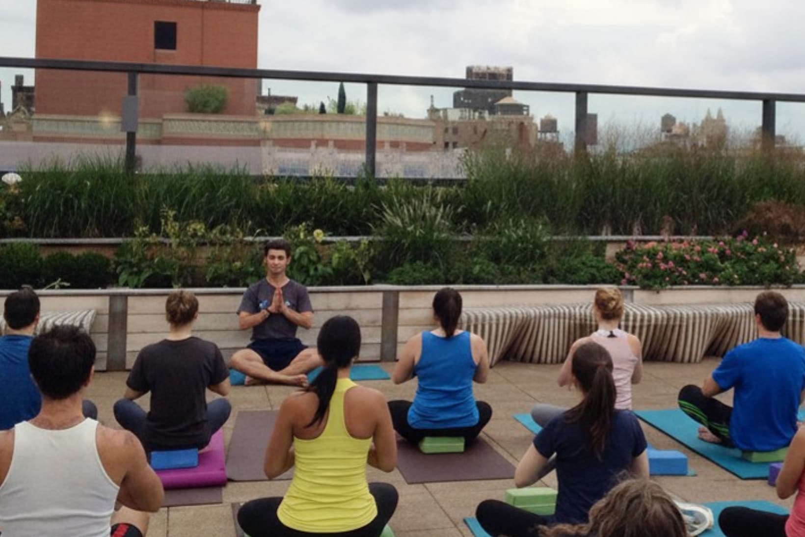 People doing yoga on the roof