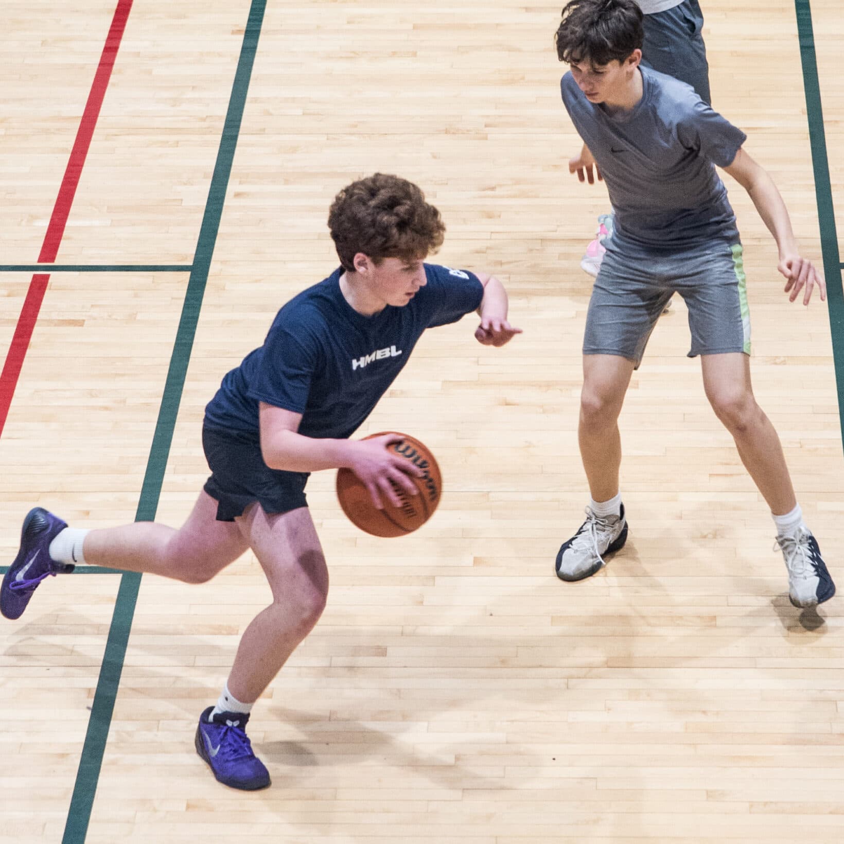 Two guys playing basketball