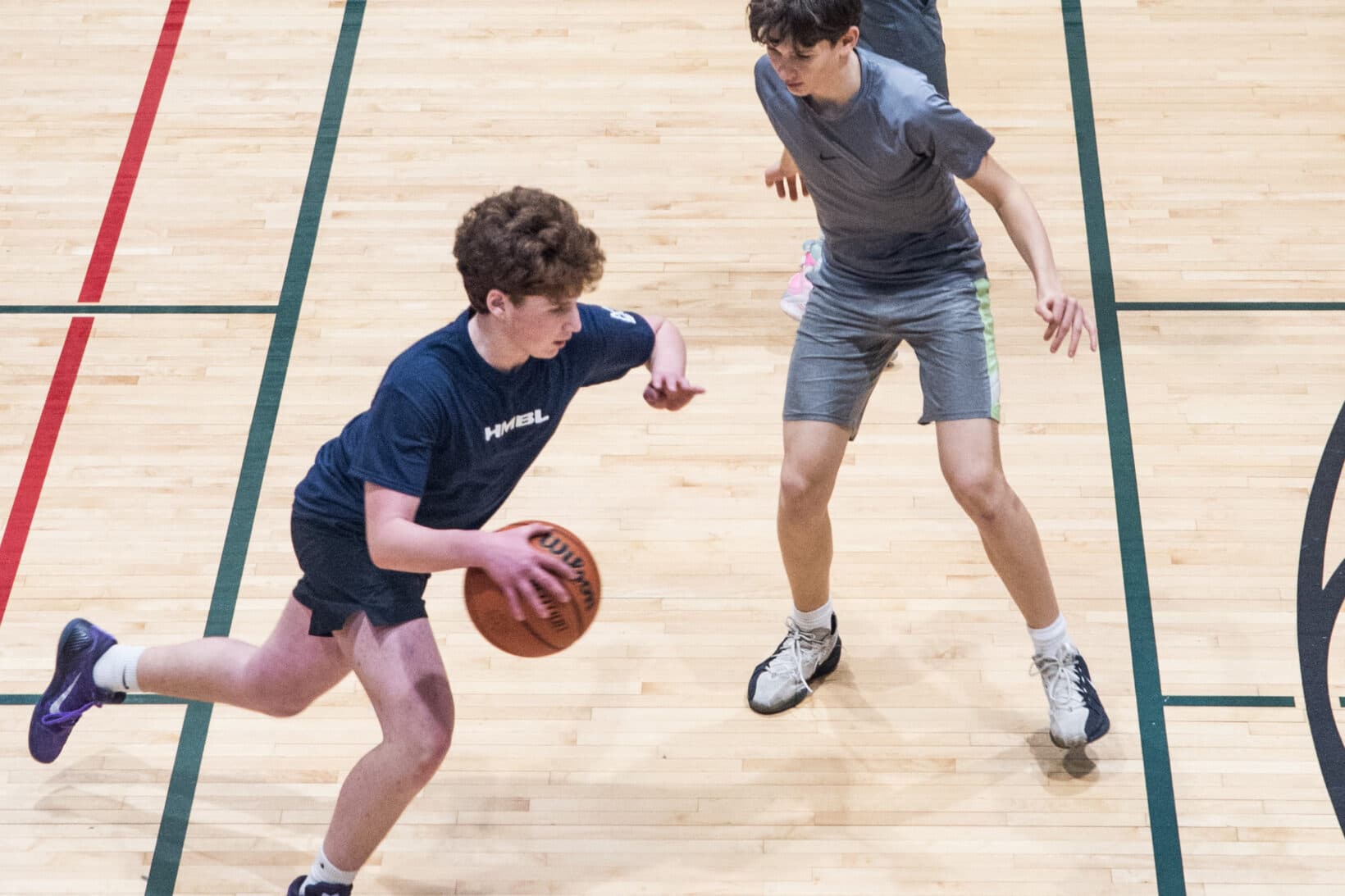 Guys playing basketball